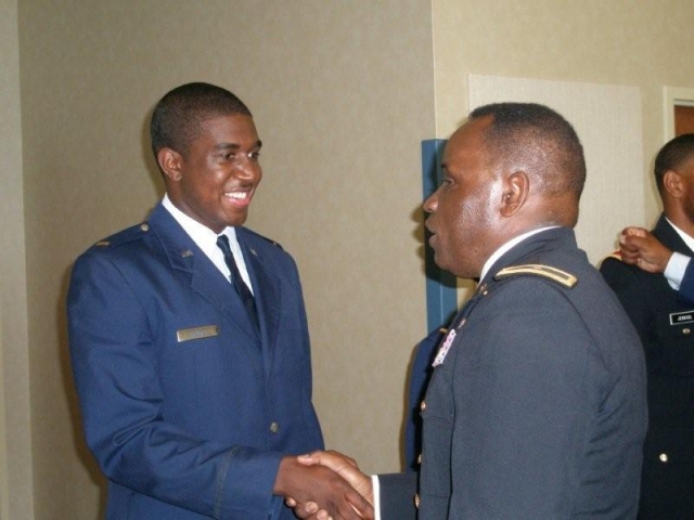 Lt. Brandan Ward receiving congratulations from General Moore of the USAF